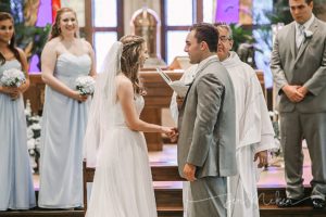 wedding vowels at the church alter
