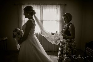 silhouette of bride and her mom wedding veil