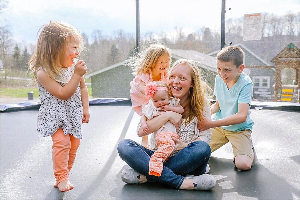 mom on the trampoline with her children