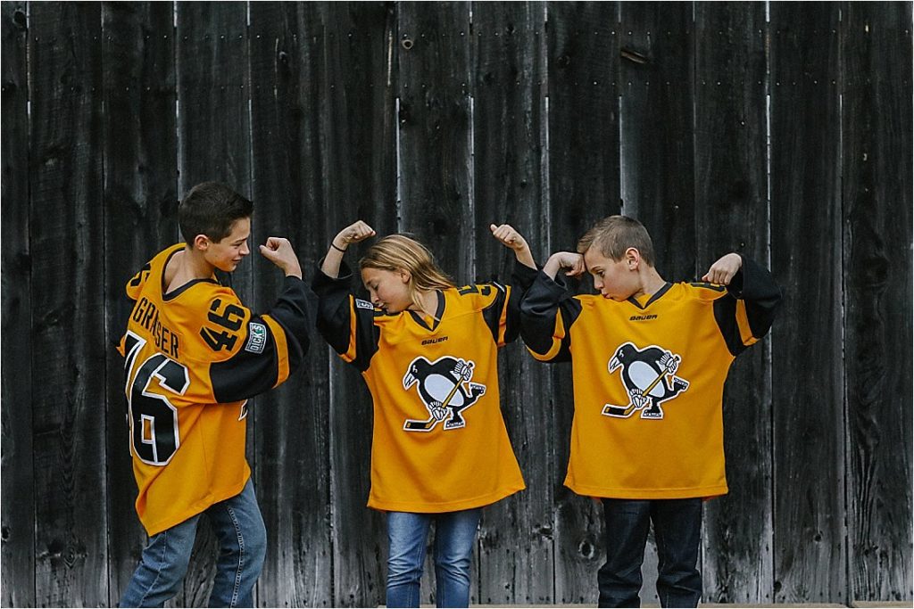 fall family photo with pittsburgh penquin jerseya