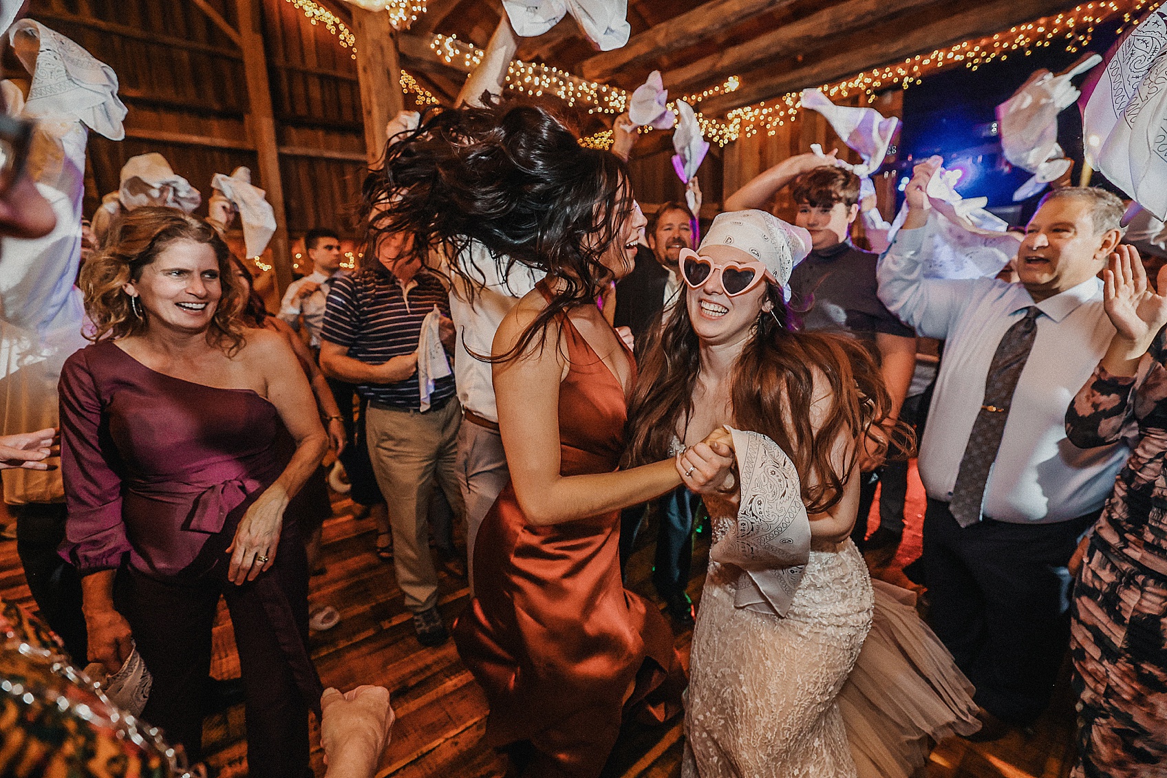 bride dancing with guests at her wedding reception