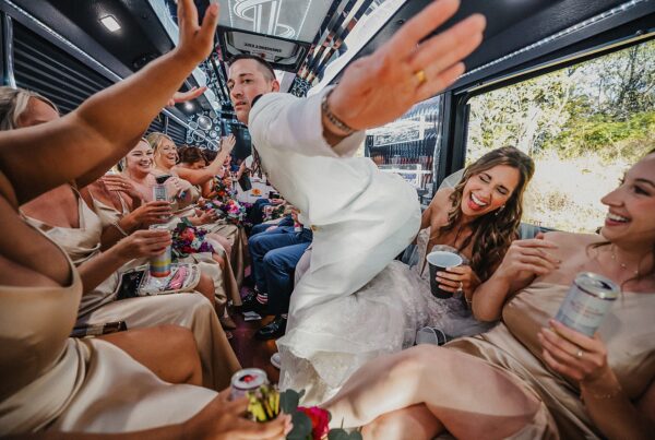 Groom dancing on the limo bus with his wedding party.