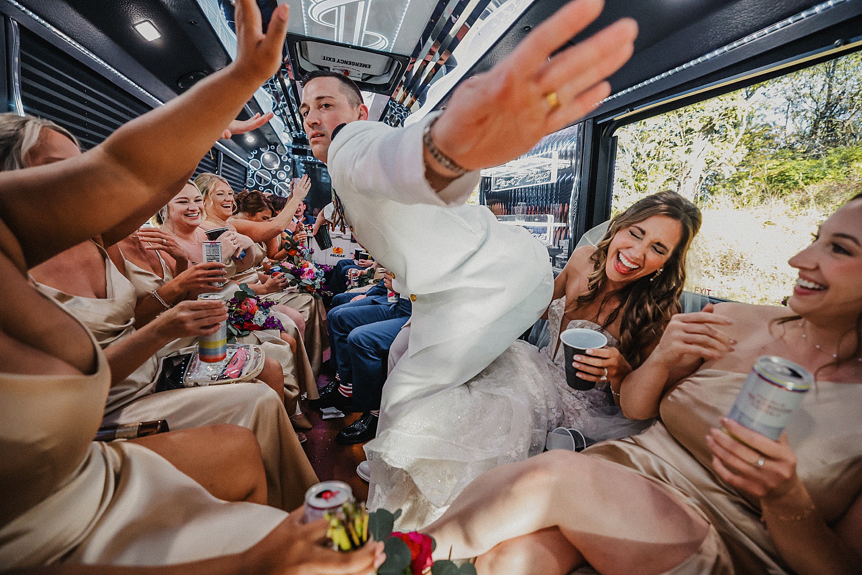 Groom dancing on the limo bus with his wedding party.